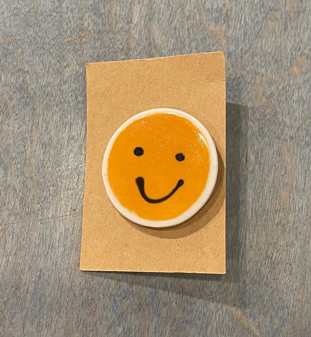 Smiley face ceramic pins