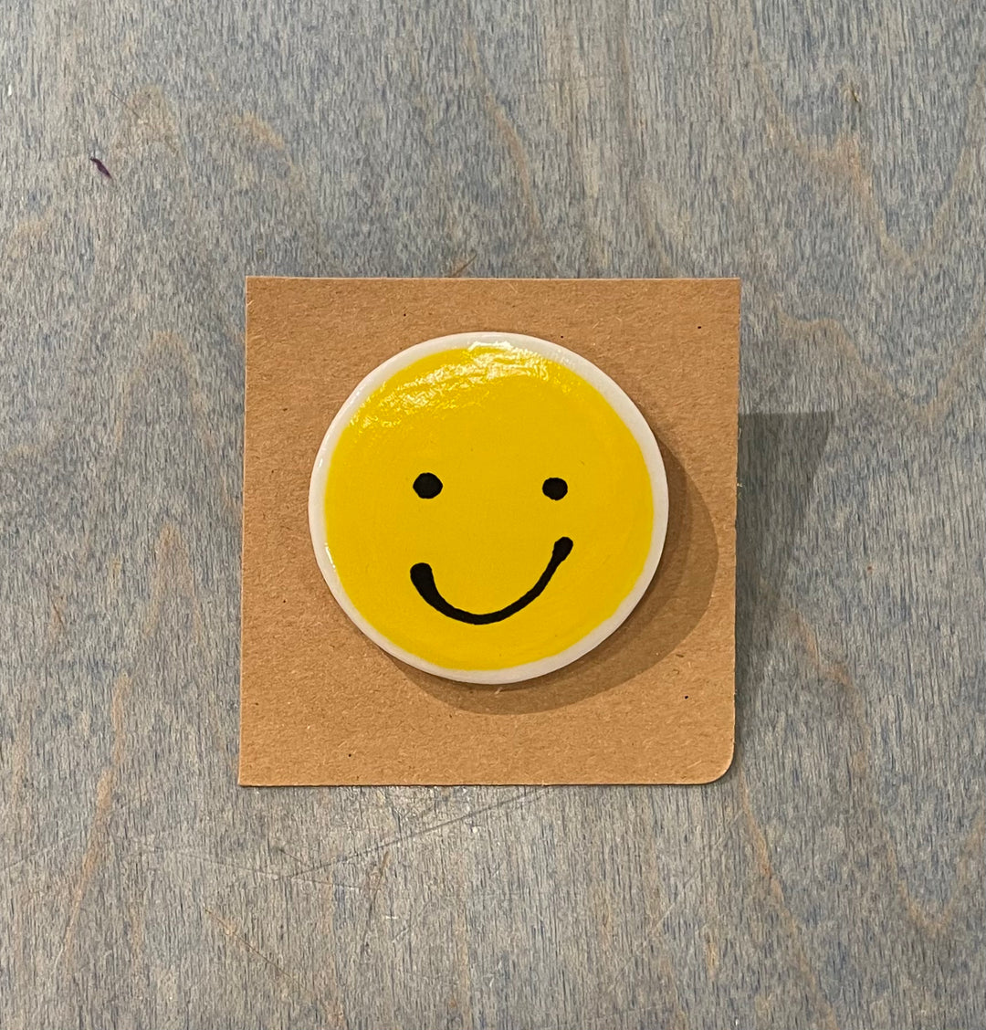 Smiley face ceramic pins