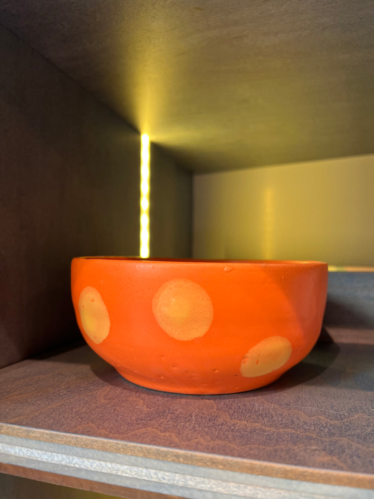 Mini orange bowl with yellow polka dots